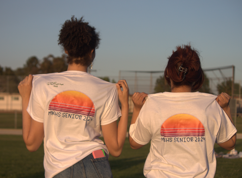 Megan Garibay and Mallory Boncacas showing off their senior sunset shirts